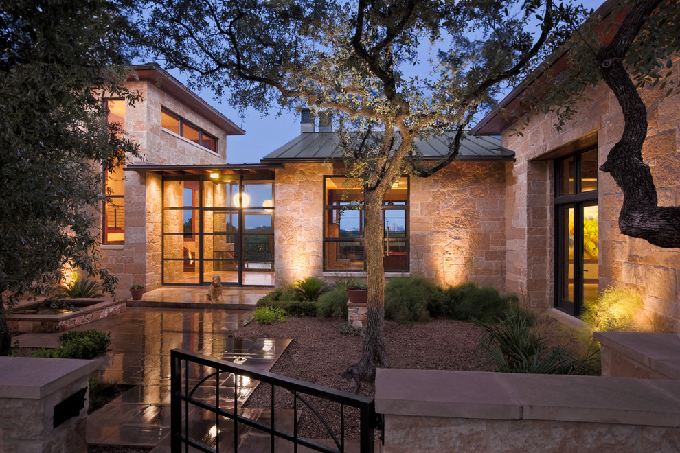 Inspiration for a contemporary entryway remodel in Austin with a glass front door