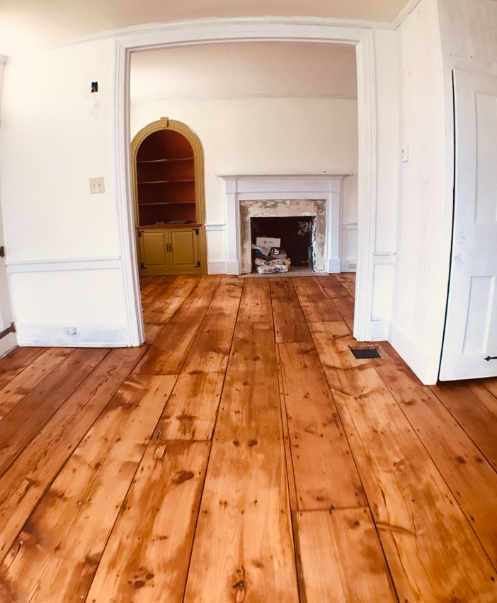 Inspiration for a classic entrance in Philadelphia with white walls, medium hardwood flooring and brown floors.