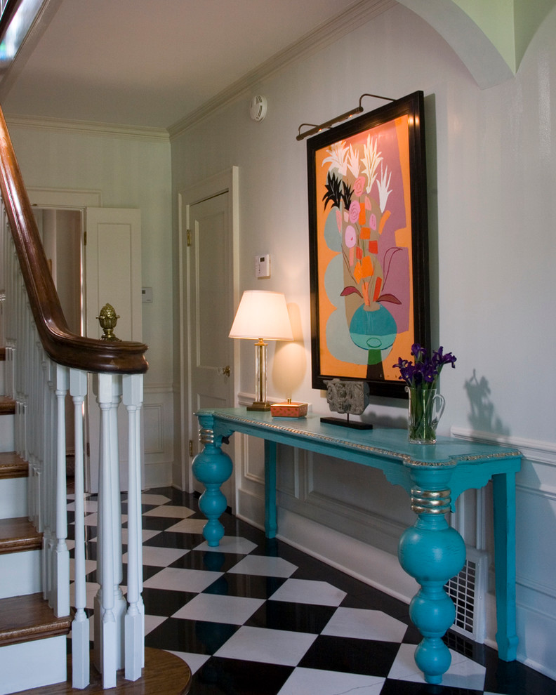 This is an example of a medium sized eclectic hallway in San Diego with white walls, porcelain flooring and multi-coloured floors.