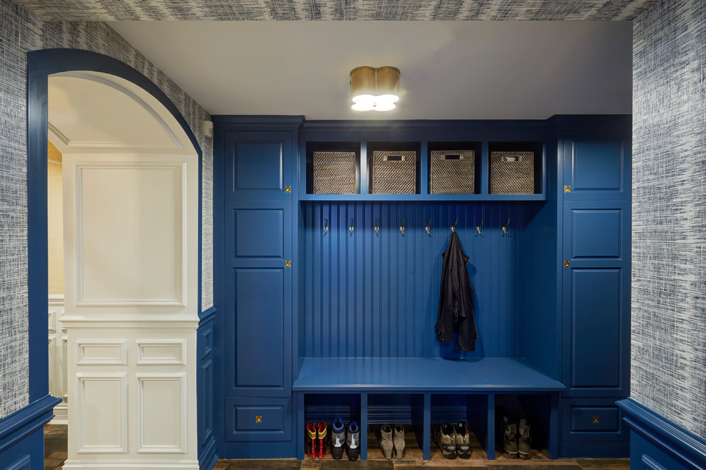 Inspiration for a large transitional porcelain tile and brown floor mudroom remodel in Chicago with blue walls