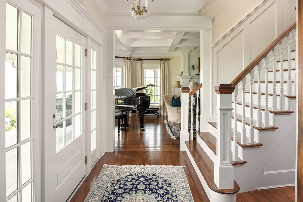 Photo of a medium sized nautical foyer in Bridgeport with white walls, medium hardwood flooring, a single front door and a glass front door.