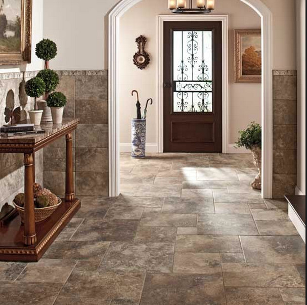 Mid-sized trendy travertine floor and gray floor entryway photo in Tampa with beige walls and a dark wood front door
