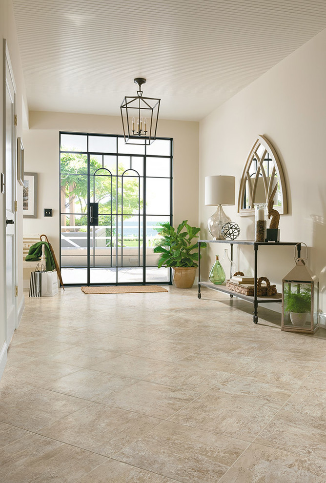 Example of a transitional vinyl floor entryway design in Columbus with white walls