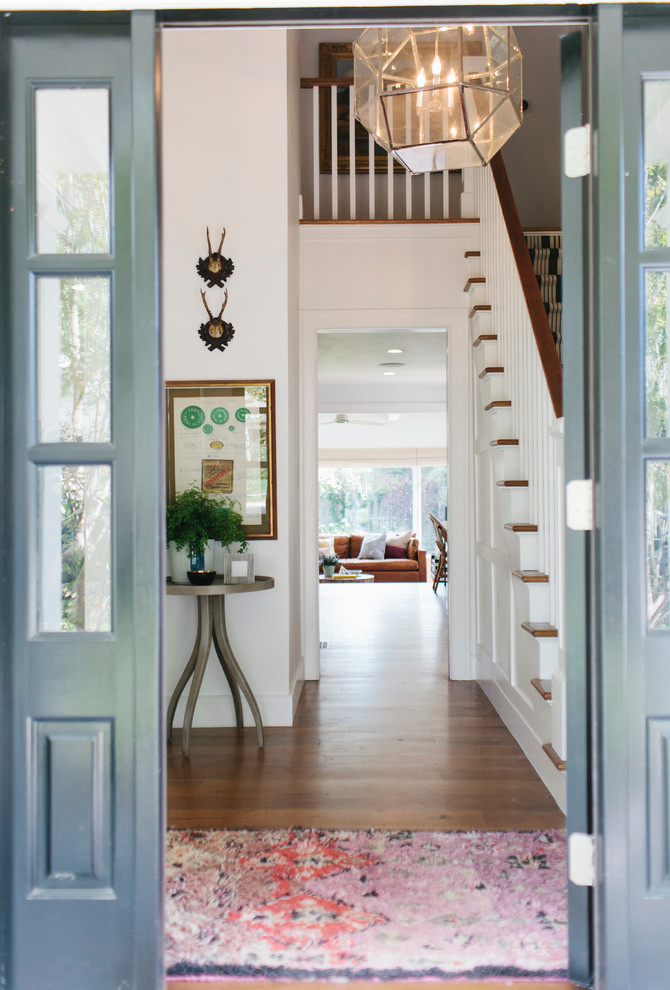 Inspiration for an eclectic entrance in Salt Lake City with white walls and dark hardwood flooring.