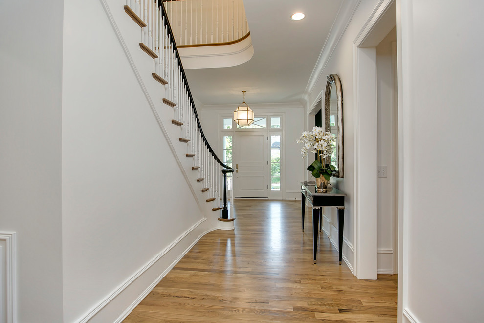 Elegant foyer photo in Raleigh with white walls