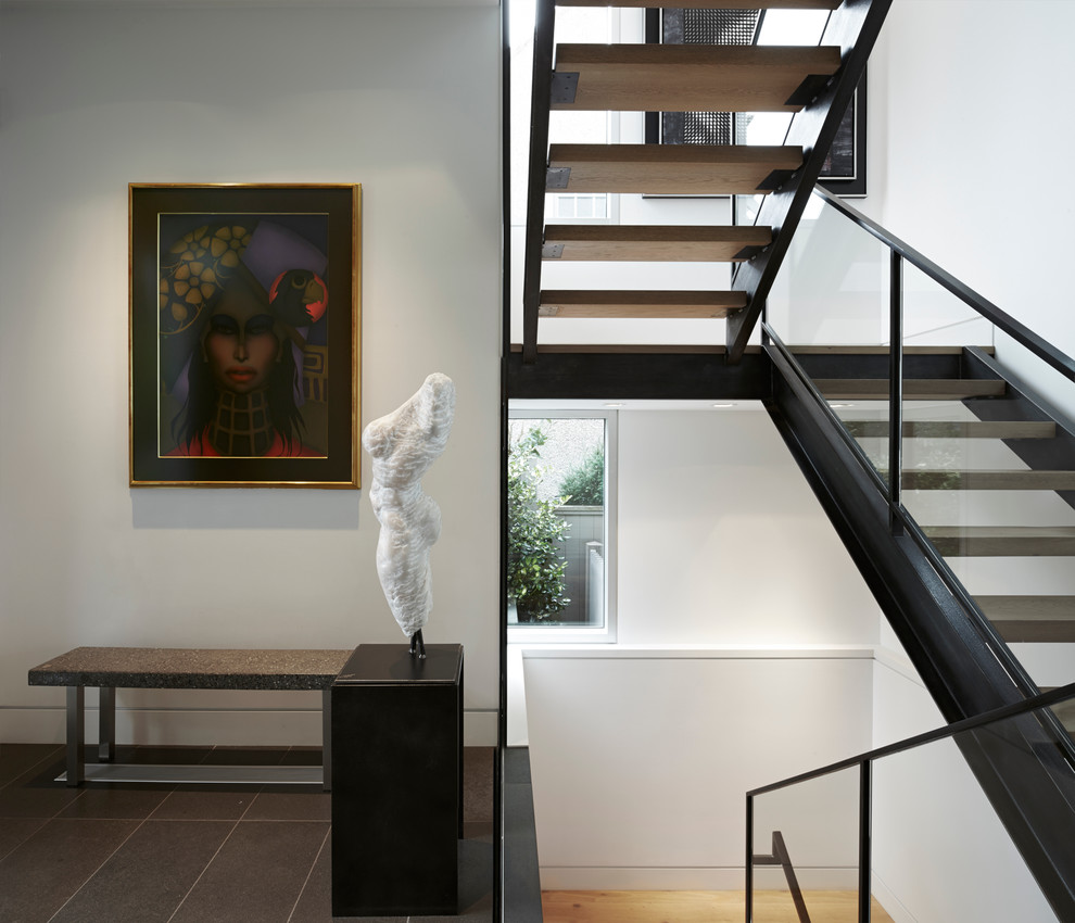 Example of a mid-sized minimalist foyer design in Vancouver