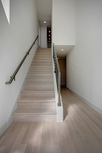 This is an example of a medium sized contemporary staircase in Seattle.