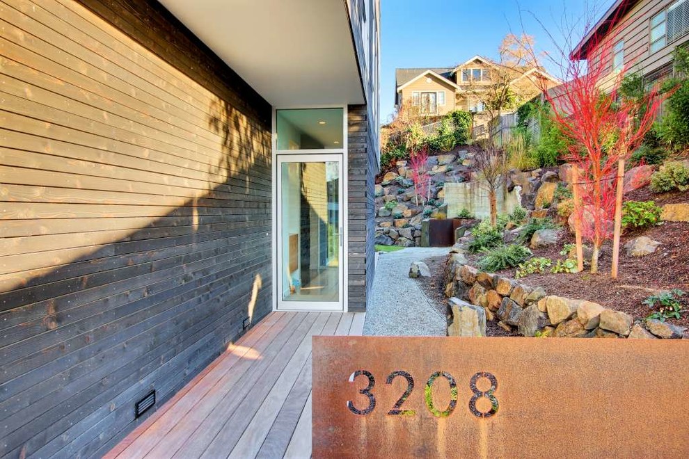 Contemporary front door in Seattle with a single front door and a glass front door.