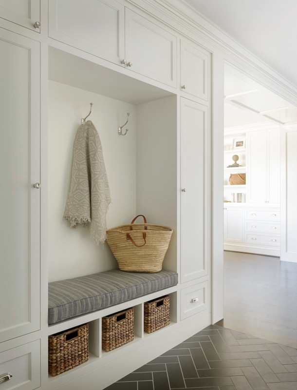 Example of a large classic ceramic tile mudroom design in Seattle with white walls