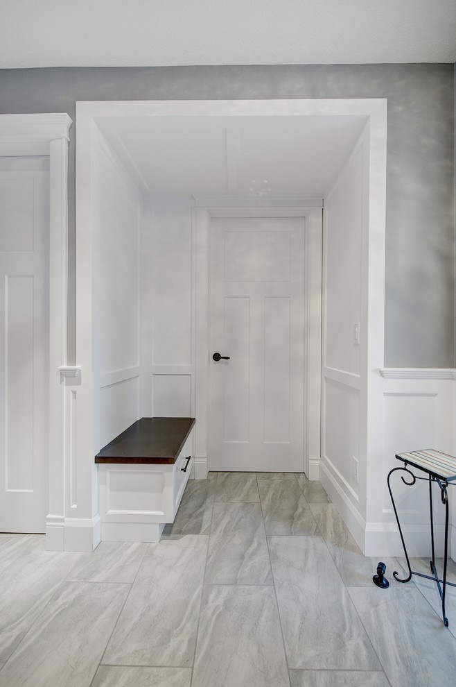 Design ideas for a medium sized classic vestibule in Calgary with grey walls, porcelain flooring, a single front door, a white front door and beige floors.