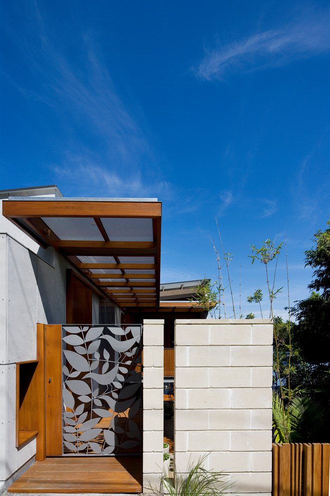 Inspiration for a contemporary front door remodel in Sydney with a metal front door
