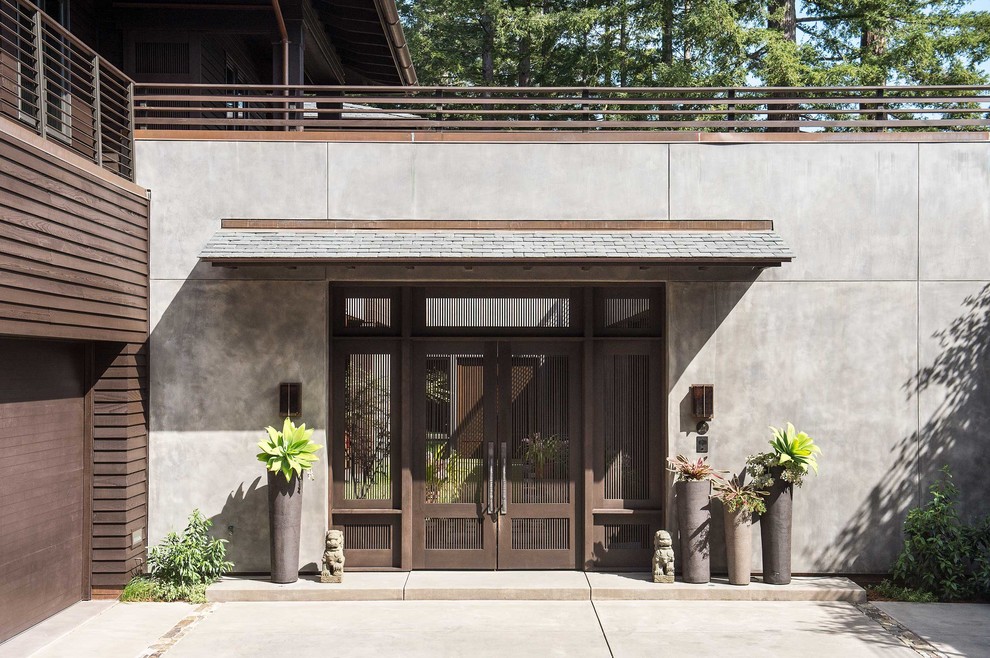 Идея дизайна: входная дверь в современном стиле с серыми стенами, бетонным полом, двустворчатой входной дверью, коричневой входной дверью и серым полом