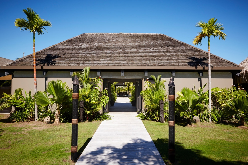 Example of an island style entryway design in Other