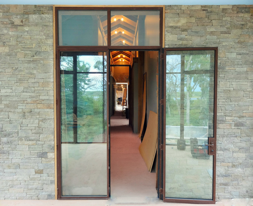 Design ideas for a contemporary entrance in New York with a double front door.