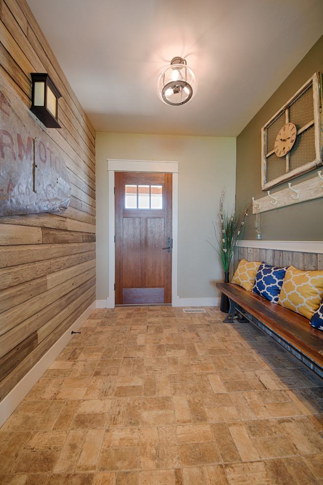 Entryway - mid-sized transitional travertine floor and beige floor entryway idea in Denver with green walls and a medium wood front door