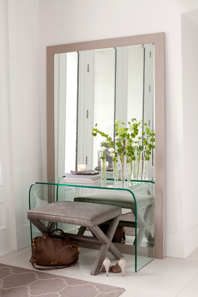 Trendy white floor entryway photo in Vancouver with white walls