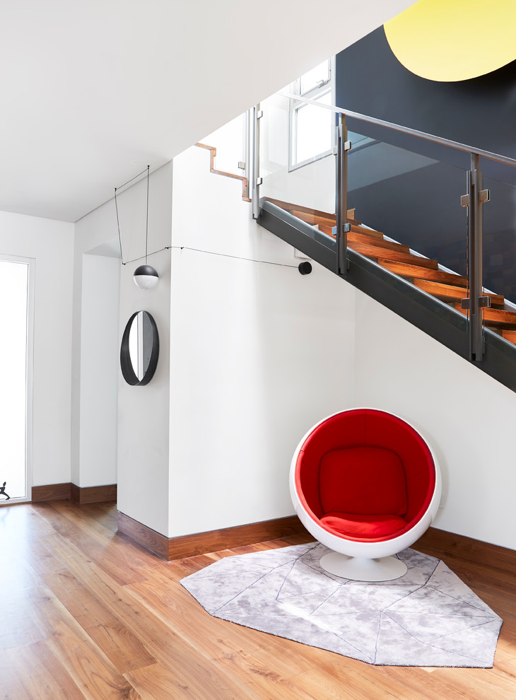 Inspiration for a contemporary light wood floor foyer remodel in Los Angeles with white walls