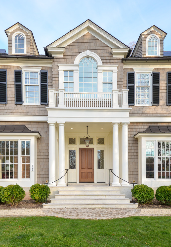 Inspiration for a classic front door in DC Metro with a single front door and a medium wood front door.