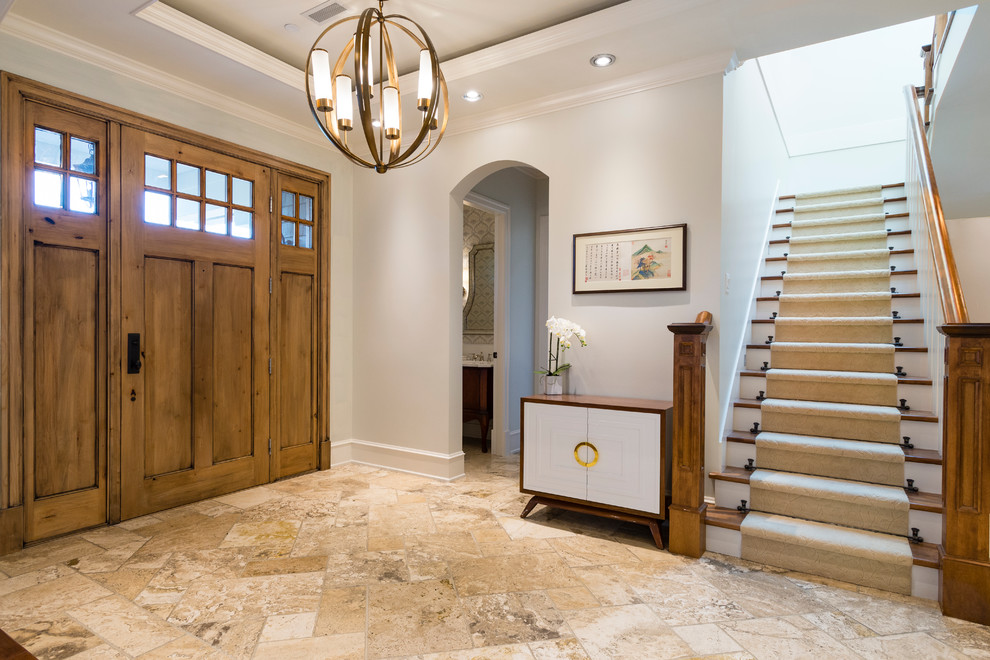 Photo of a large classic foyer in Vancouver with grey walls, travertine flooring, a single front door and a light wood front door.