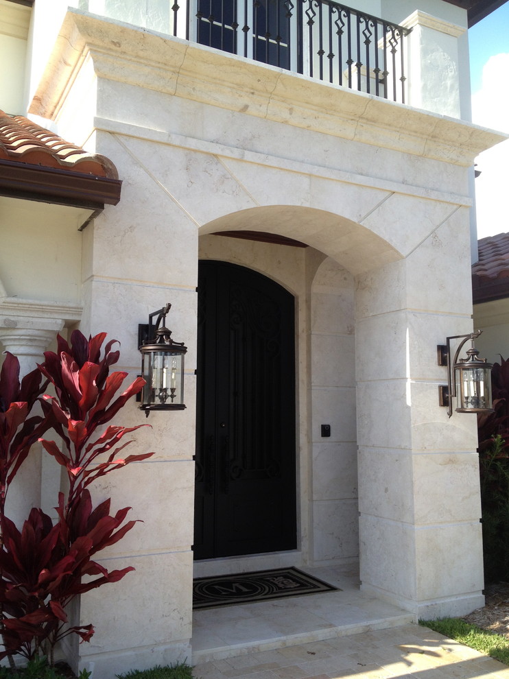 Large tuscan entryway photo in Miami