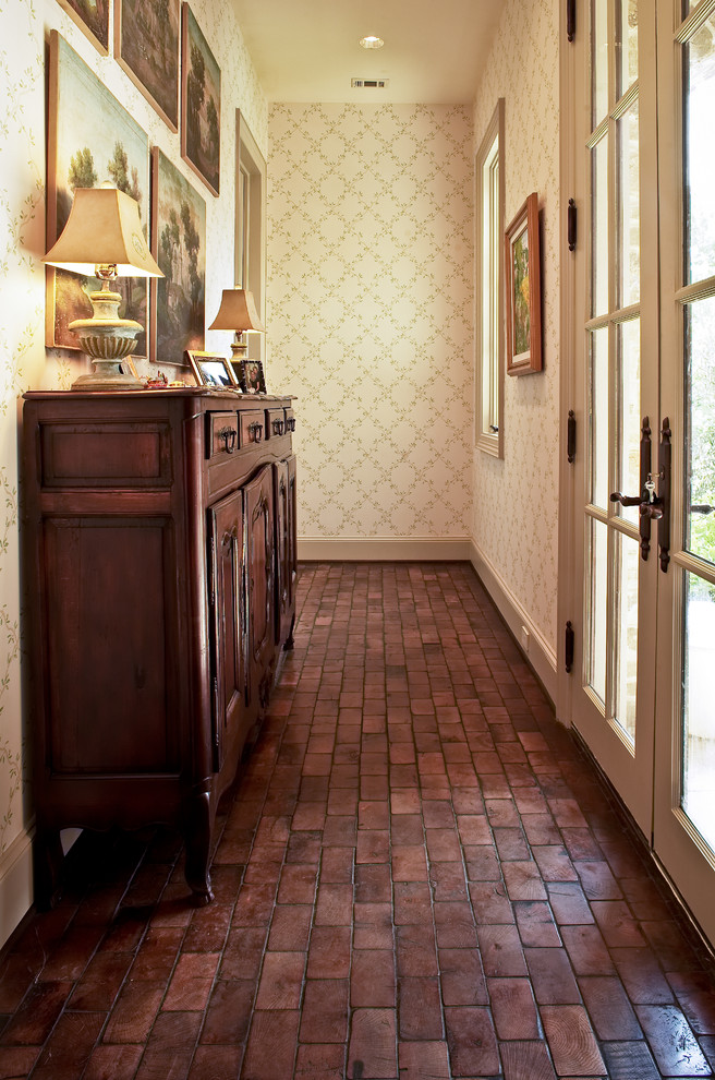 Tuscan brick floor entryway photo in Houston