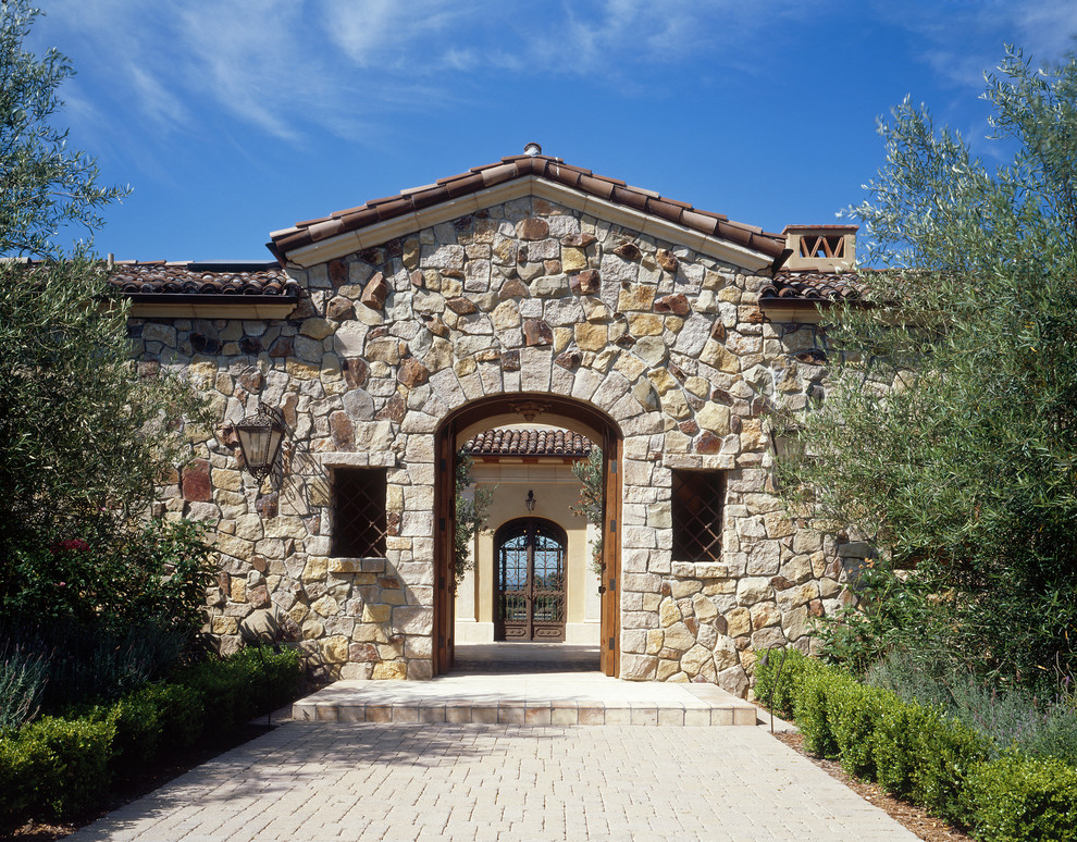 Inspiration for a mediterranean front door in San Diego with a double front door.