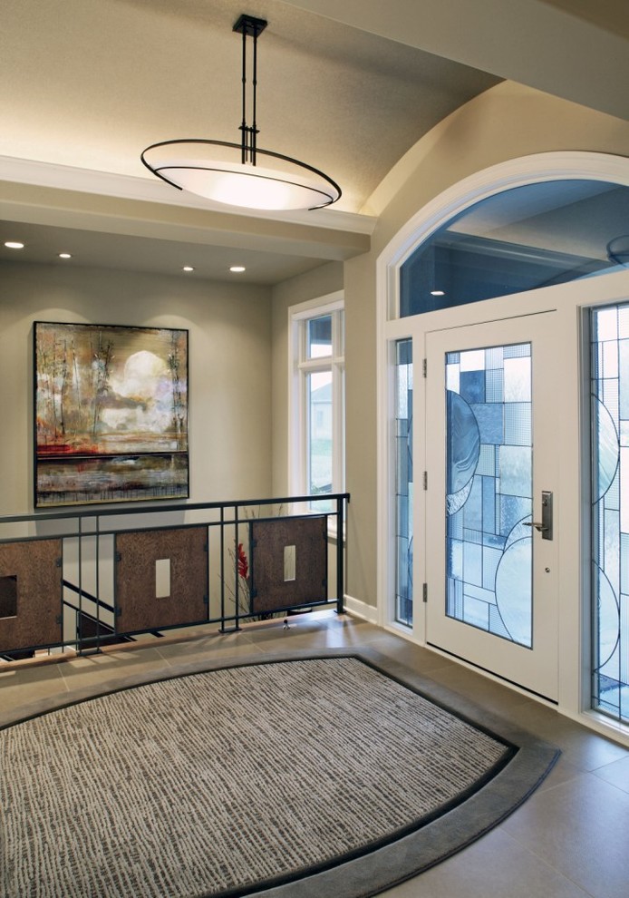 Inspiration for a contemporary entryway remodel in Omaha
