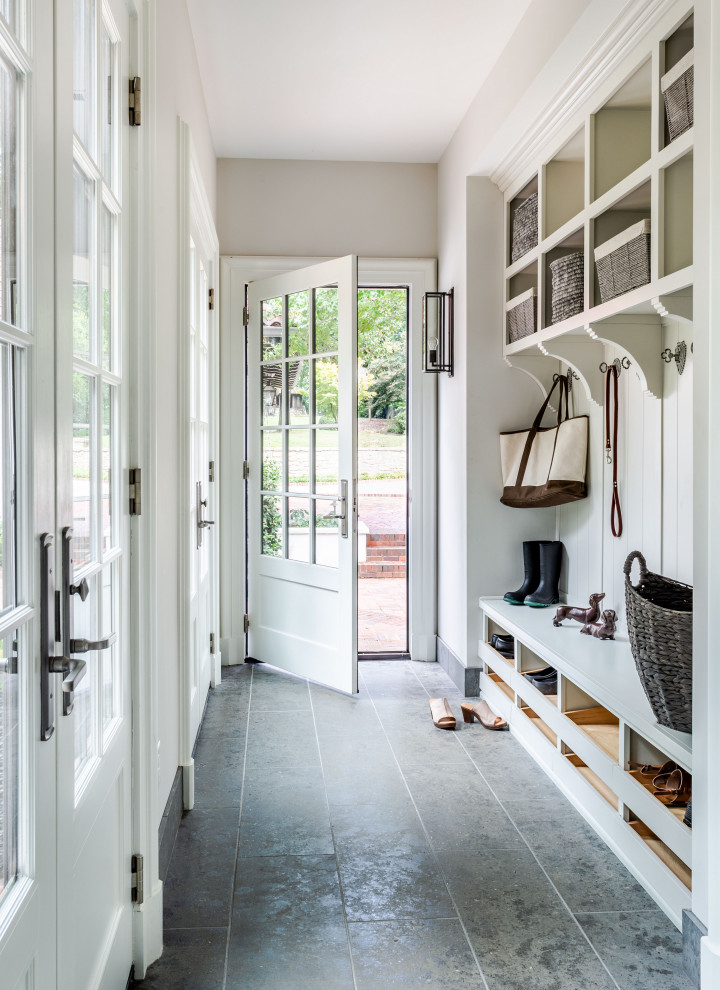 Entryway - transitional gray floor entryway idea in Atlanta with beige walls and a white front door