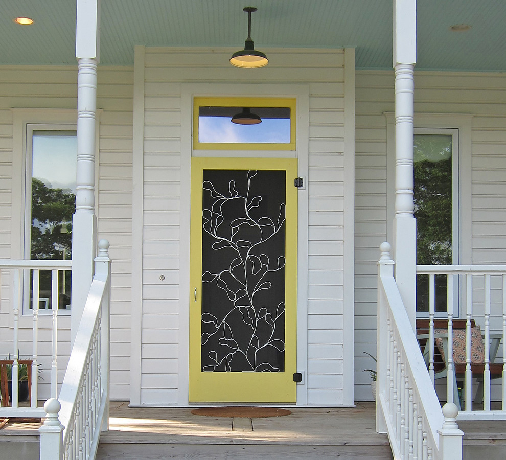 Example of a classic entryway design in Austin with a yellow front door