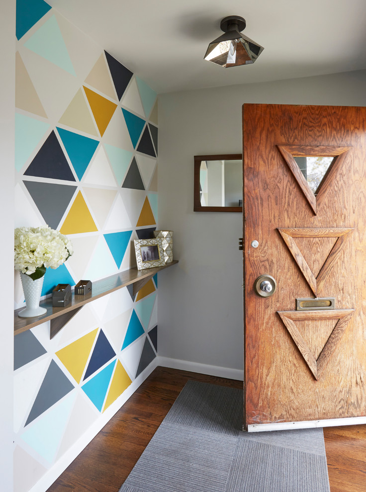 Inspiration for a 1950s dark wood floor and brown floor entryway remodel in Chicago with multicolored walls and a brown front door
