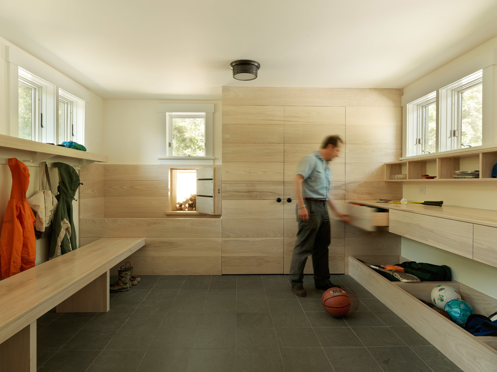 Rustic boot room in Burlington with white walls.