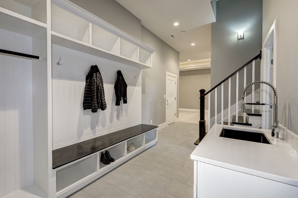 Huge trendy porcelain tile and gray floor mudroom photo in DC Metro with gray walls