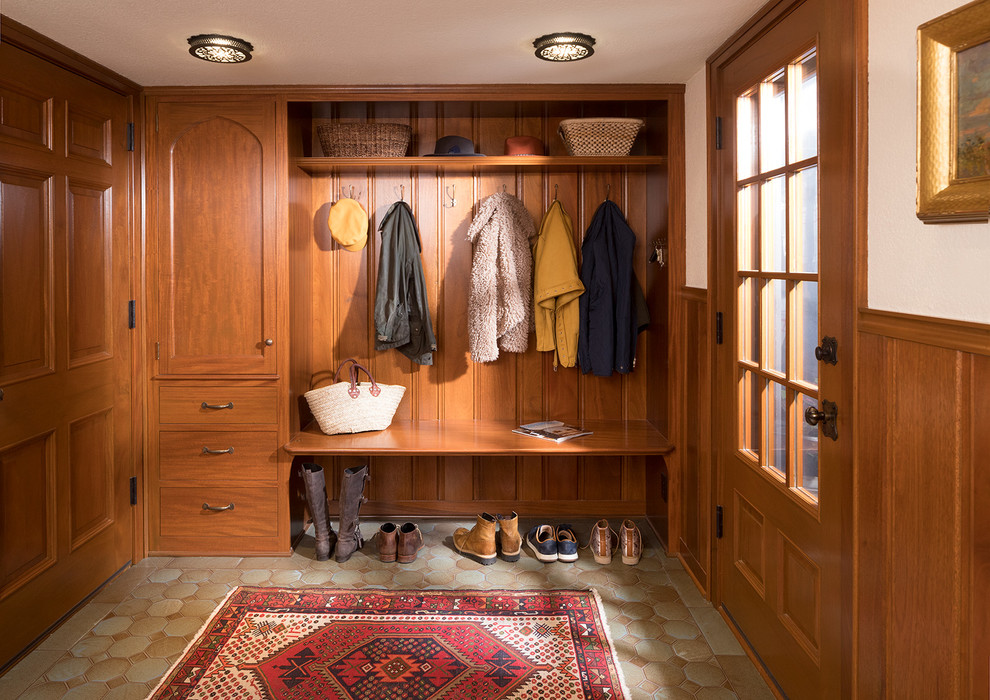 Elegant beige floor single front door photo in Minneapolis with white walls and a medium wood front door