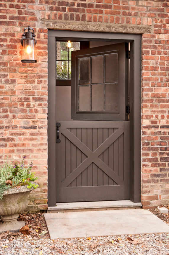 Inspiration for a small timeless entryway remodel in New York with a dark wood front door