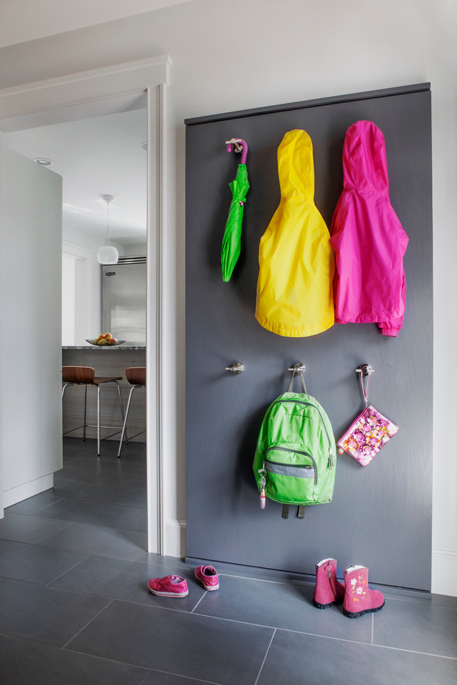 Example of a trendy slate floor mudroom design in Boston