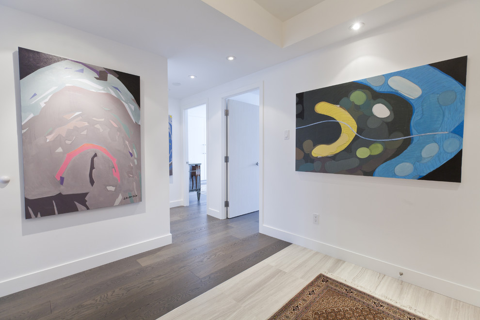 Example of a minimalist entryway design in Toronto with white walls