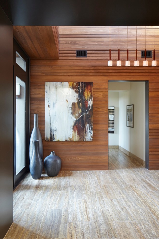 Example of a mid-sized minimalist foyer design in Austin