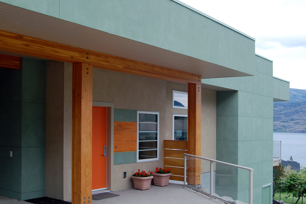 Inspiration for a mid-sized modern entryway remodel in Vancouver with an orange front door