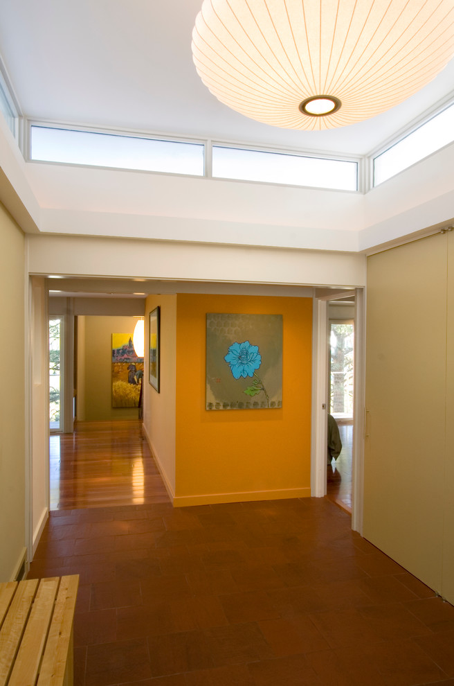 Inspiration for a contemporary entry hall remodel in New York with white walls