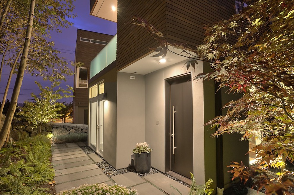 Design ideas for a contemporary front door in Seattle with a single front door and a black front door.