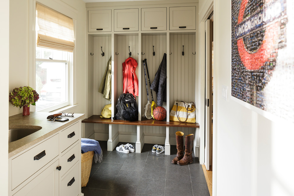 Mid-sized elegant limestone floor mudroom photo in Providence with white walls