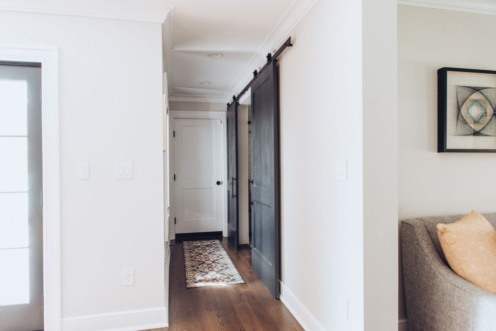 Medium sized modern boot room in New York with grey walls, dark hardwood flooring, a single front door, a black front door and a coffered ceiling.
