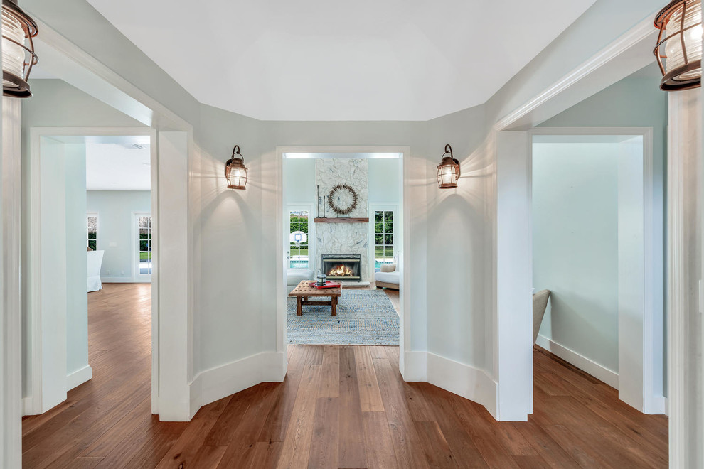 This is an example of a rural entrance in Miami with medium hardwood flooring.