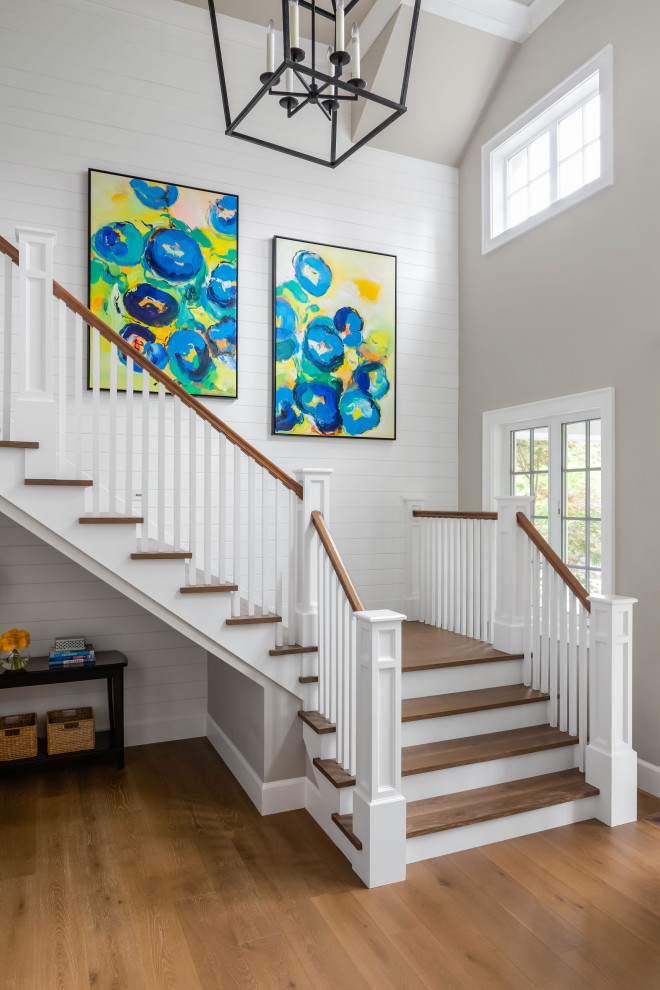 Inspiration for an expansive traditional staircase in Seattle with tongue and groove walls.