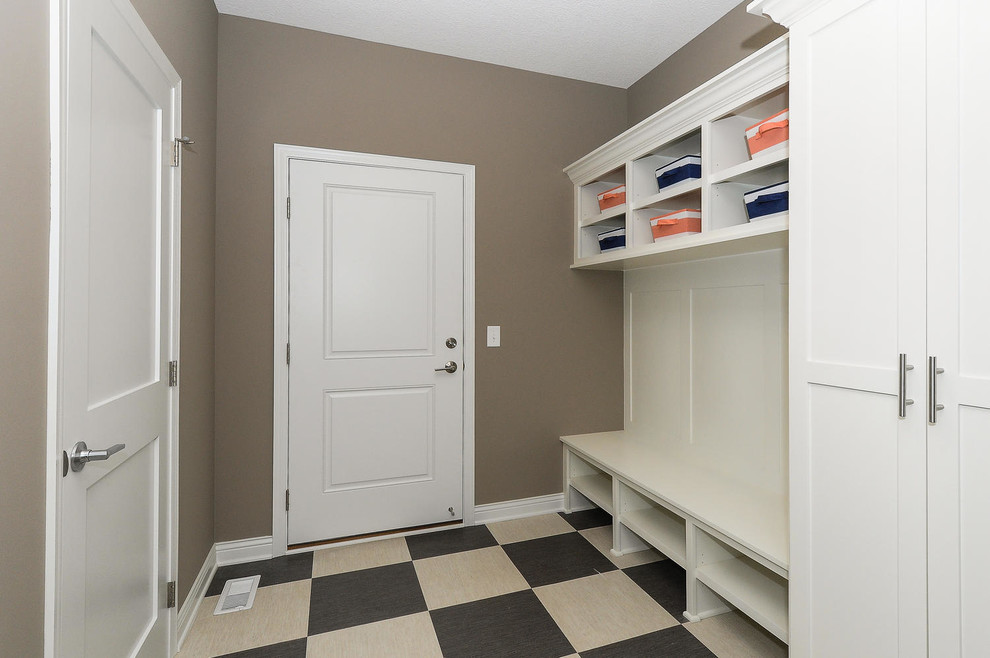 Inspiration for a small transitional vinyl floor and brown floor mudroom remodel in Minneapolis with brown walls