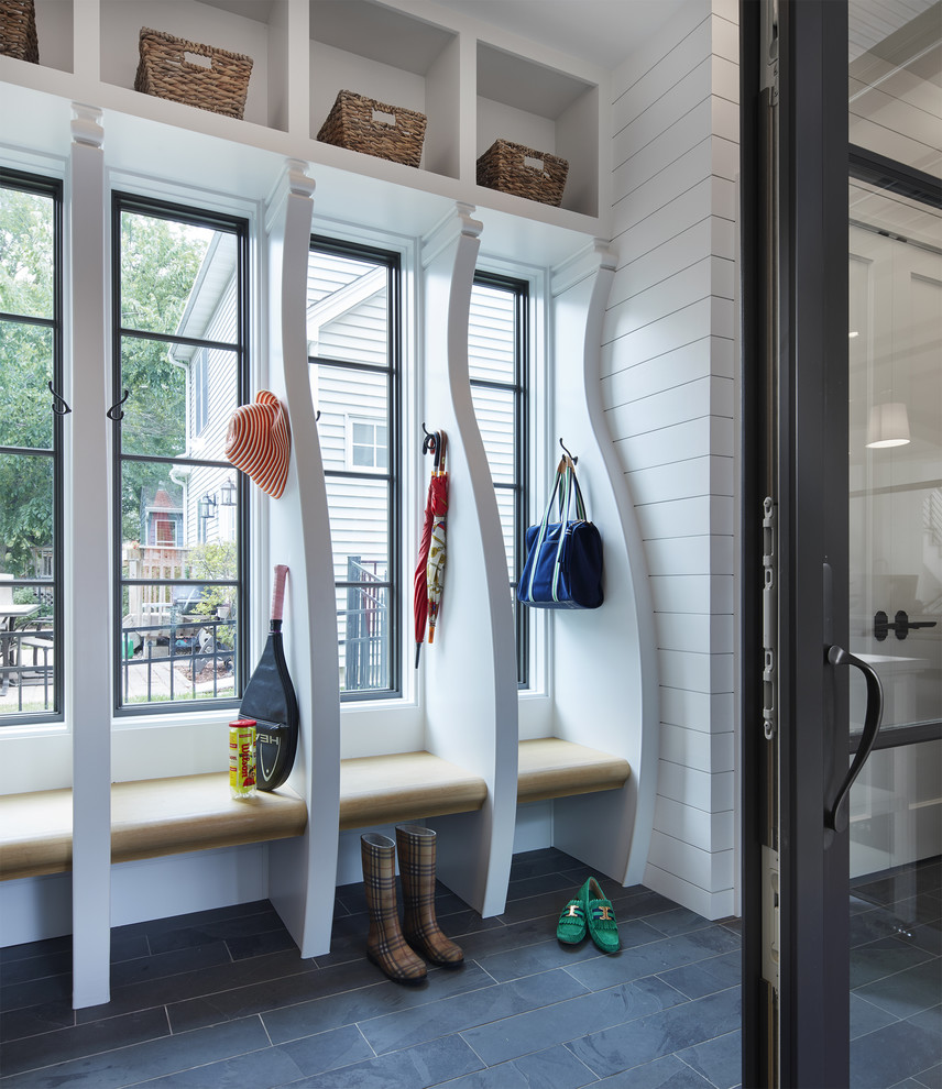 Design ideas for a rural boot room in Minneapolis with white walls, a glass front door and black floors.