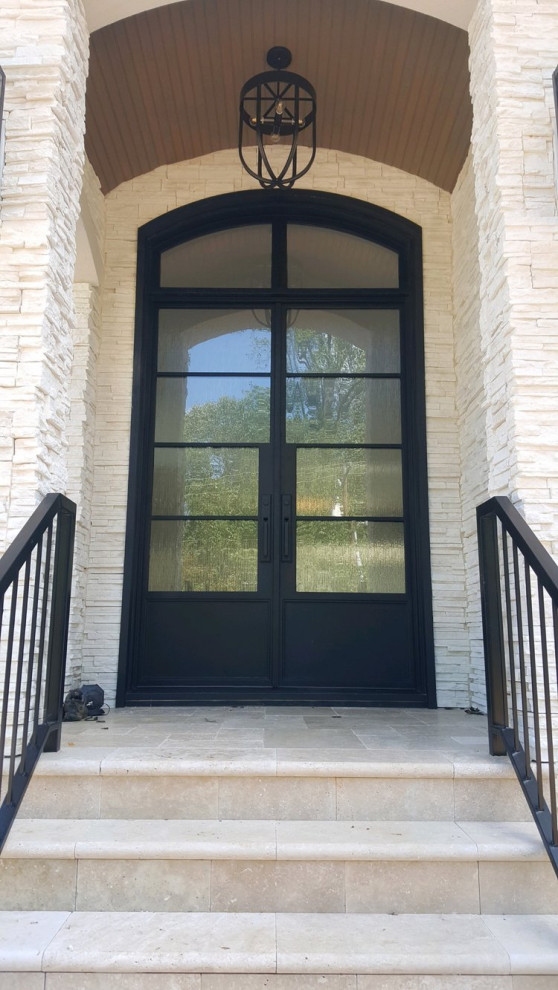 Inspiration for a contemporary entrance in Charlotte with a black front door.