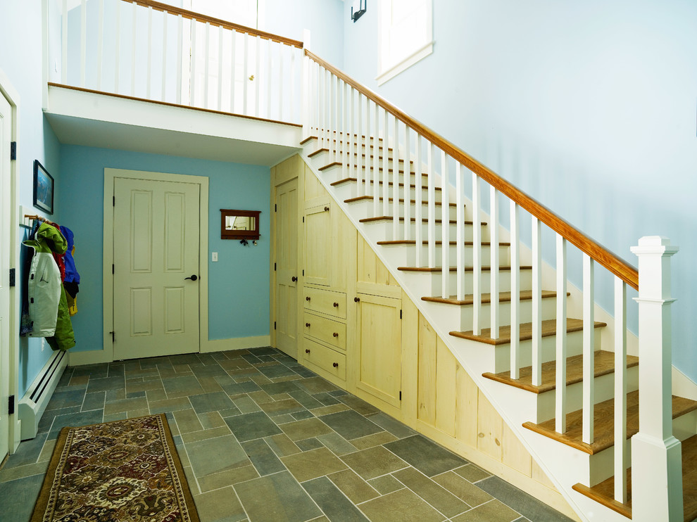 Inspiration for a large craftsman slate floor entryway remodel in Burlington with blue walls and a white front door