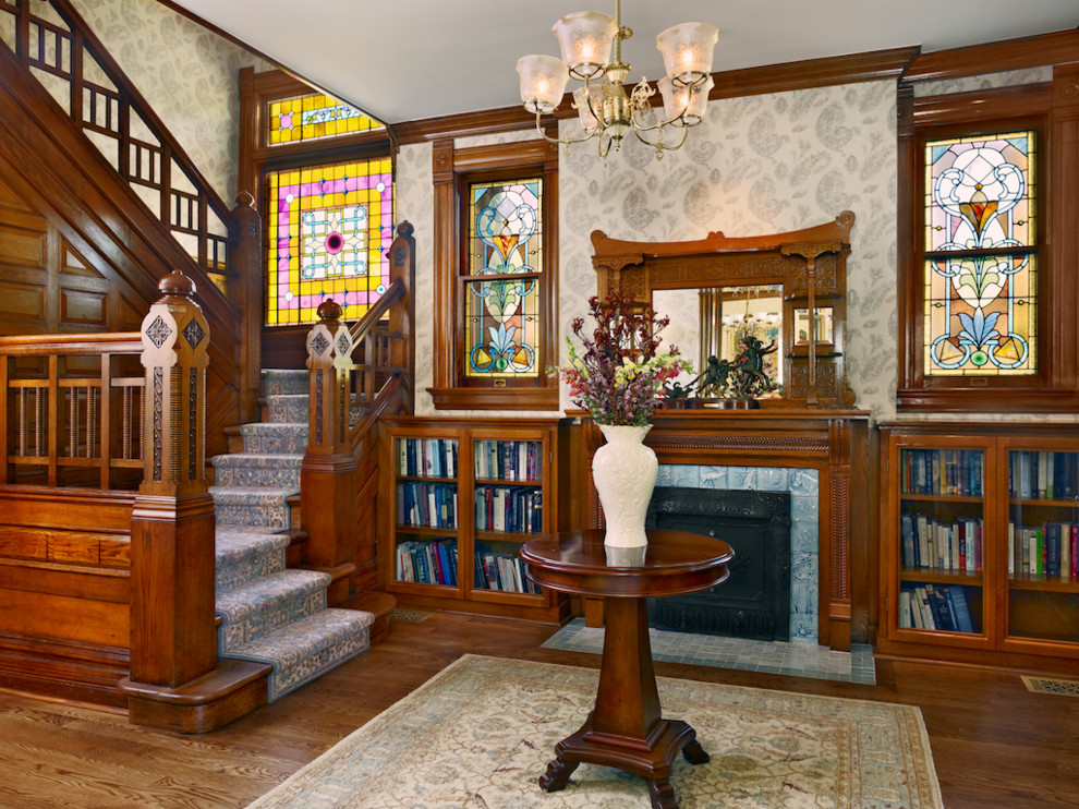 Inspiration for a medium sized victorian foyer in Denver with grey walls and medium hardwood flooring.