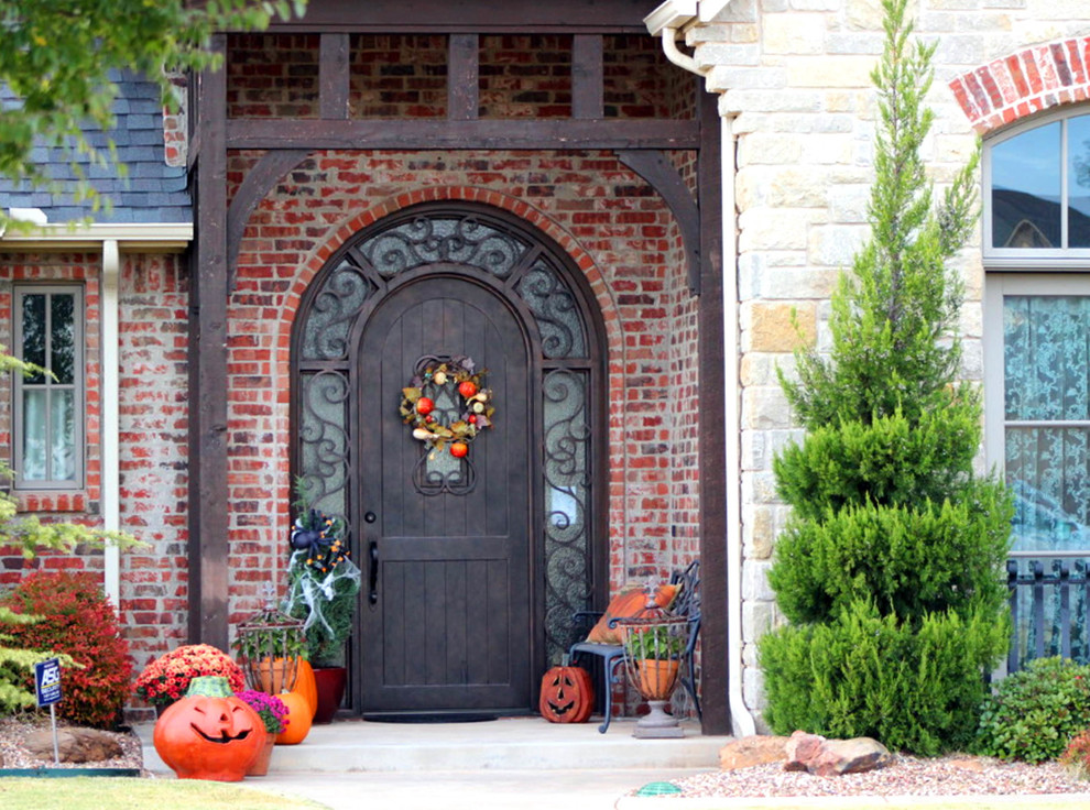 Inspiration for a medium sized traditional front door in Oklahoma City with a single front door and a metal front door.